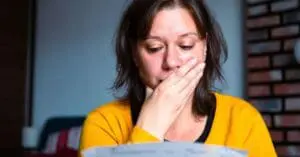 Aisling's story -woman at risk of homelessness reading rent fees